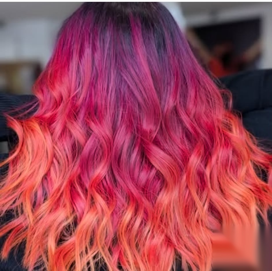 Vivid pink and orange balayage colour finished at Dolly Rocks