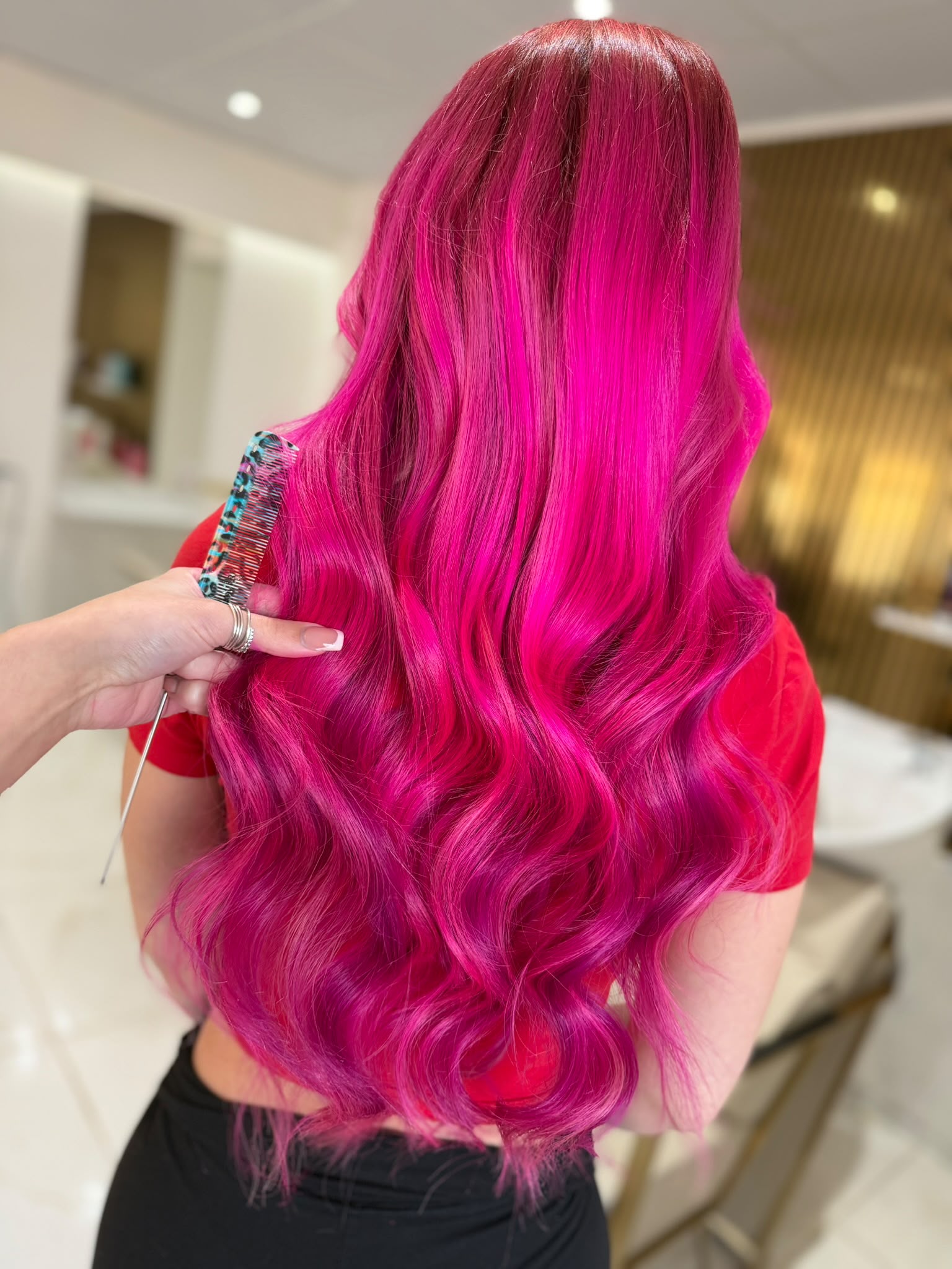 Vivid pink cut and styling finished at Dolly Rocks