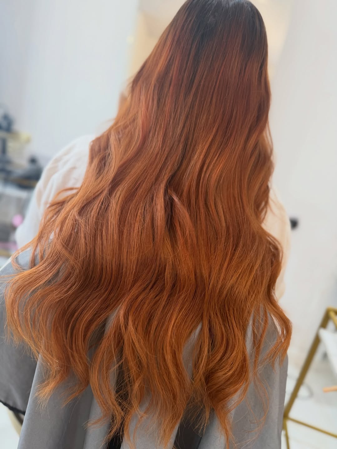 Wavy copper hair extensions styled at Dolly Rocks